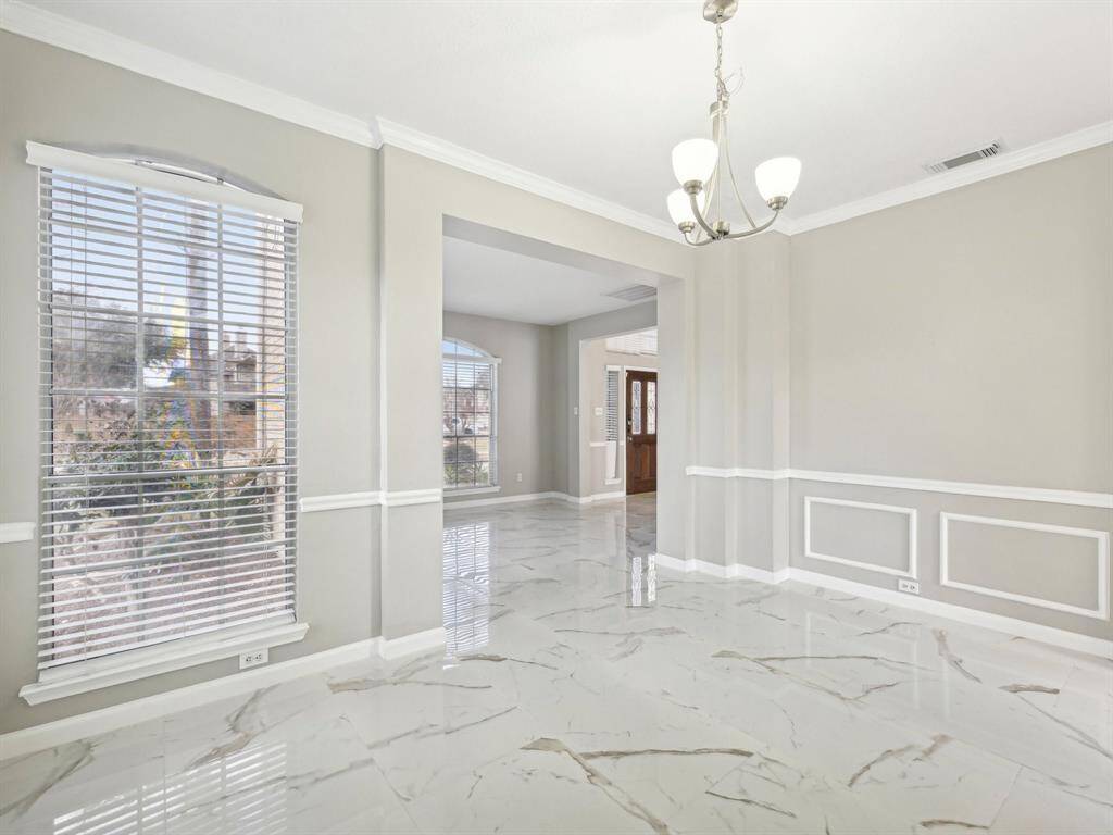 The Formal Dining Room is the focal point of all your gatherings. It has lovely crown, chair rail and picture frame moldings.