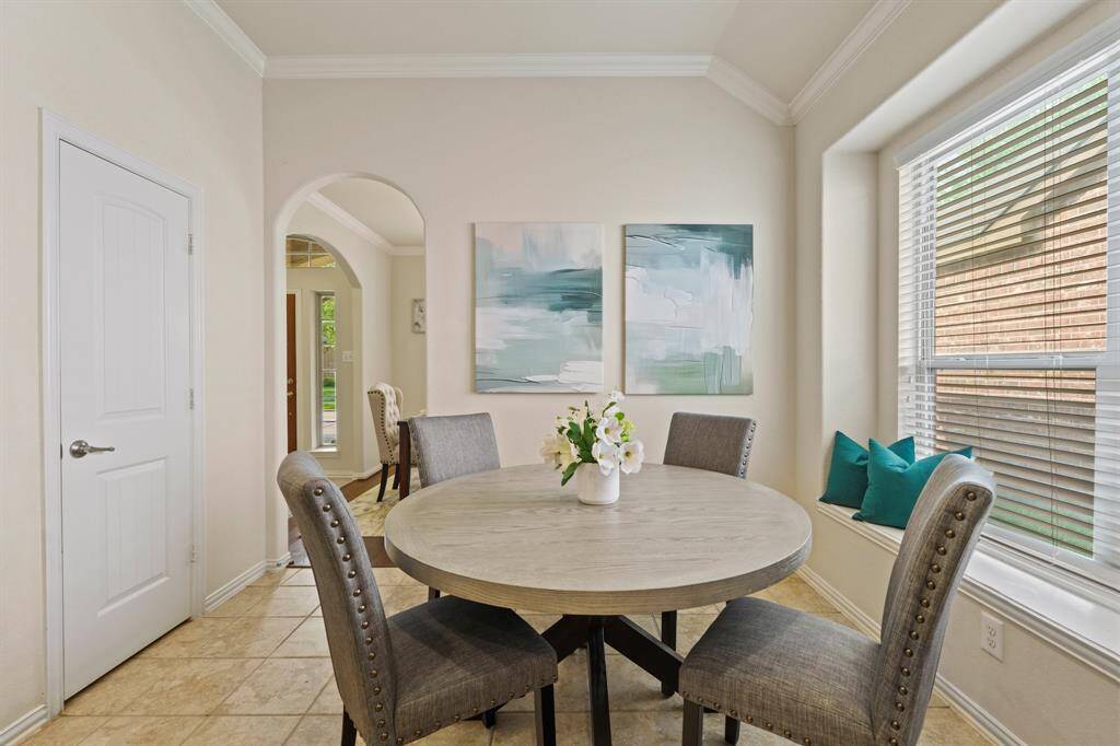 Entertaining is a snap with both a formal dining room and a casual breakfast area, perfectly appointed for gatherings big or small. The thoughtful layout flows seamlessly from one dining space to the next, with easy access to the kitchen, making hosting both effortless and enjoyable.