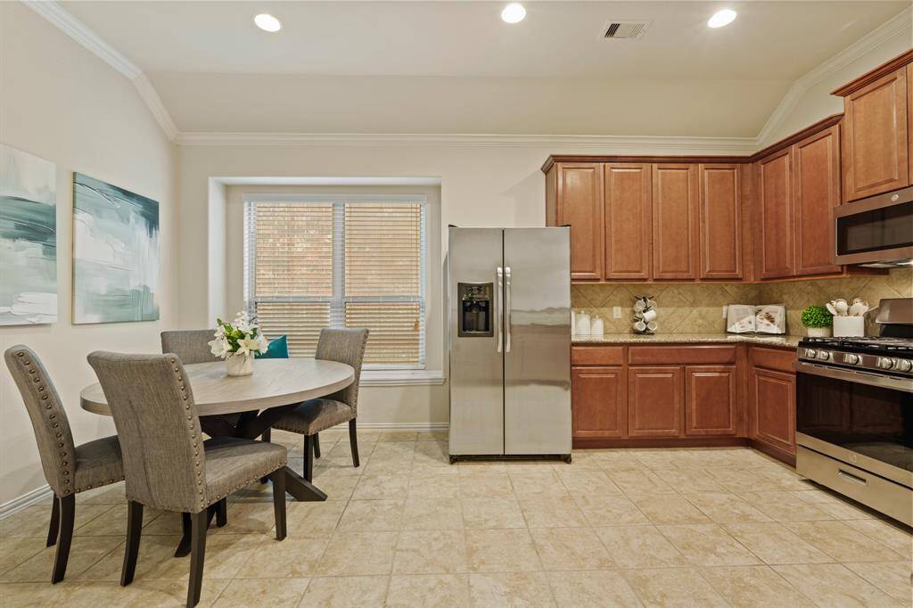 Ditch the takeout and fall in love with cooking again. This pristine kitchen has everything you need, plenty of counter space, sleek stainless steel appliances, and a raised bar that separates the kitchen from the family room, so you can stay connected while you cook.