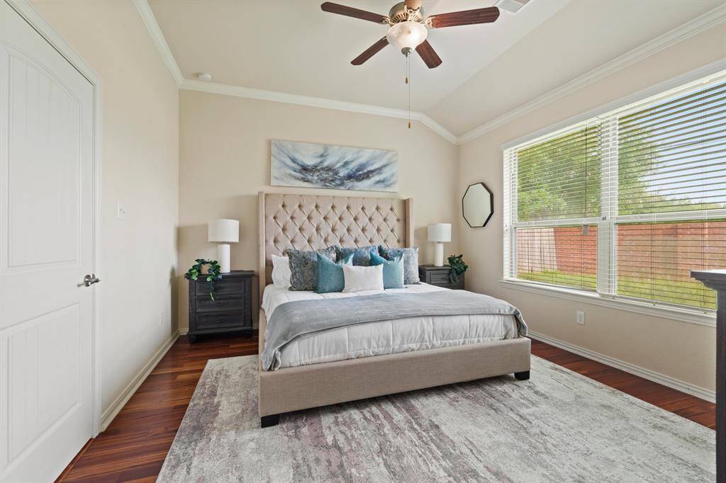 You’ll enjoy sweet dreams as you drift off to sleep in this posh owner’s retreat, featuring hardwood flooring, neutral paint, a soaring ceiling with crown molding and a lit fan, abundant natural light, a large walk-in closet, and a beautifully appointed ensuite bathroom.