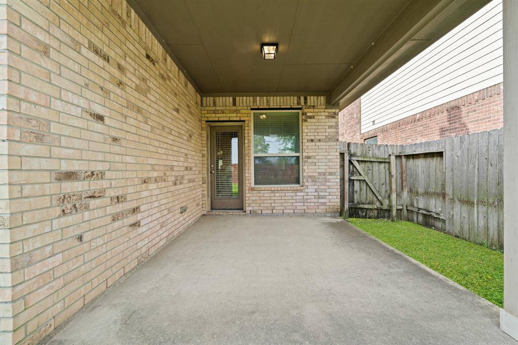 This expansive covered patio offers the perfect space for summer BBQs and backyard birthday parties, with plenty of room for your grill, seating for everyone, and space to gather and enjoy the outdoors.