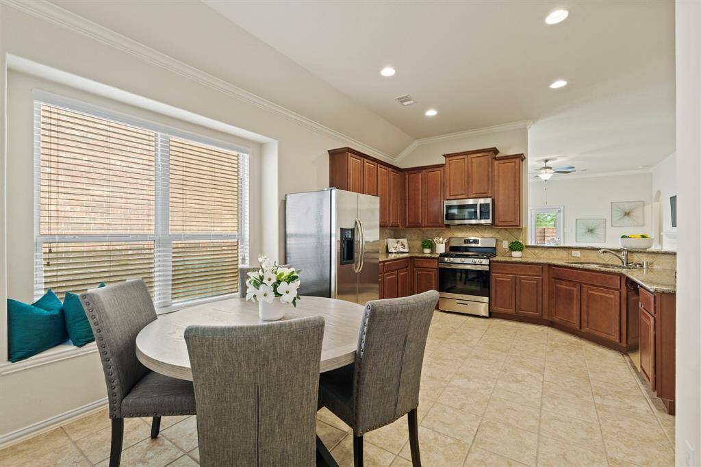 From the formal dining room, you’re led into a spacious eat-in kitchen with a charming window seat and plenty of room for your breakfast table.