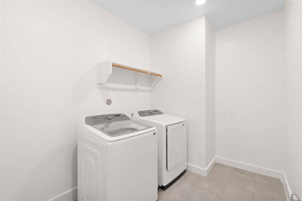 Spacious utility room located on the first floor