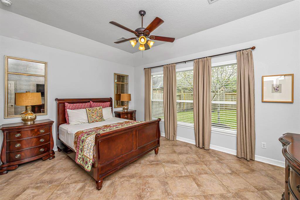 Primary en-suite bath featuring a soaking tub, enclosed shower and extended double sink granite vanity.