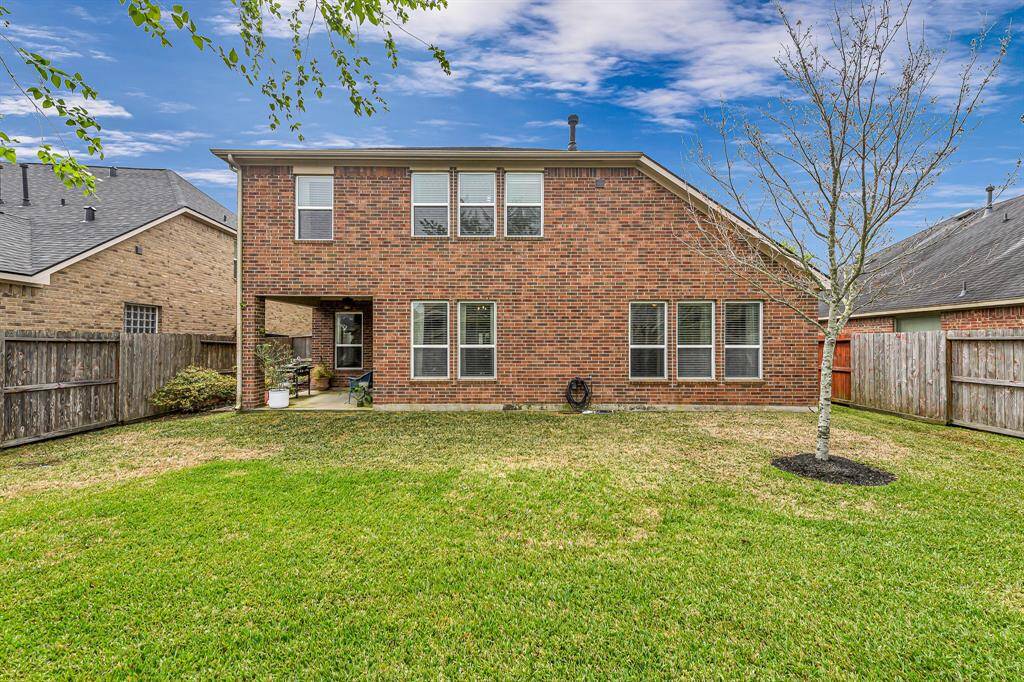 Spacious front porch offers the perfect spot for rocking chairs or seasonal decor. Enjoy peaceful mornings or relaxed evenings in the shade.