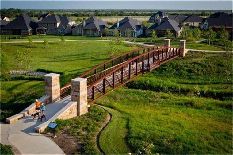 This is one of the 3 pools throughout the community. Cross Creek Ranch offers a swim team too!! Splash pad and views of the lake bring resort style living home. The Cross Creek Ranch lookout tower is in the distance.
