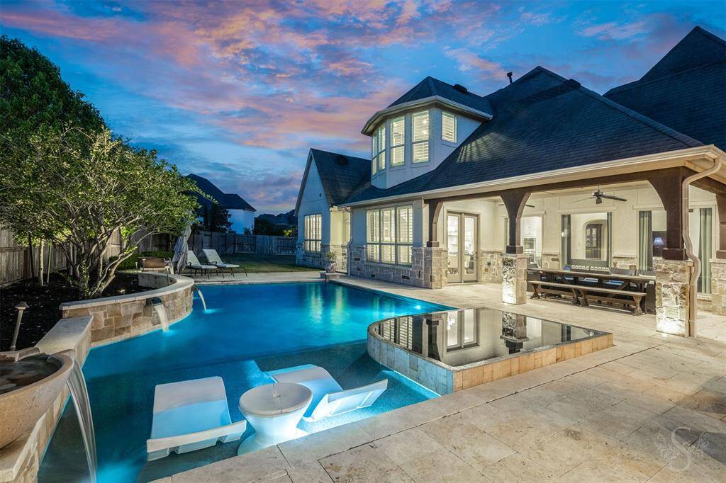 This spectacular outdoor living space offers a beautiful pool and spa, surrounded by two incredible covered patios, making it perfect for hosting friends and family. Whether lounging by the sparkling blue pool or enjoying a meal under the patios, it’s an ideal setting for entertaining in style.
