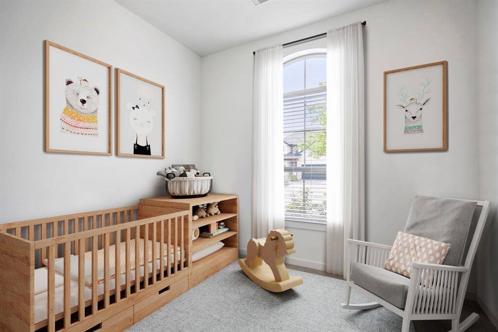 This secondary bedroom sits at the front of the home and offers plenty of natural light, plush carpet, and a spacious closet. *This room has been virtually staged