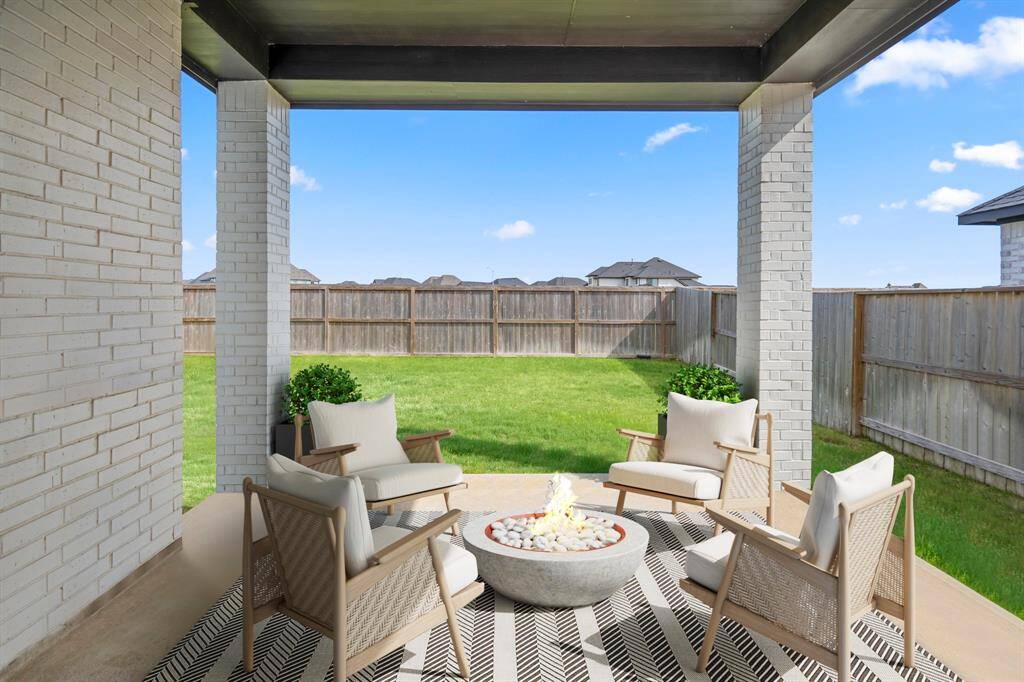 This backyard offers plenty of privacy with NO BACK NEIGHBORS! Your covered patio overlooks your huge backyard with plenty of green space to enjoy! *This photo has been virtually staged