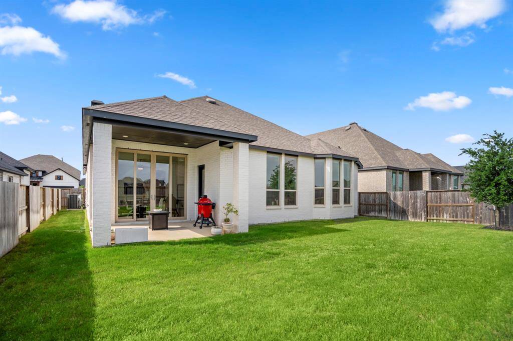 Enjoy the outdoors in this spacious and low-maintenance backyard! With plenty of room for play, gardening, or relaxing, this private outdoor space is the perfect blank canvas to make your own.