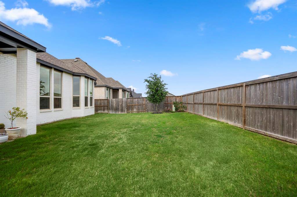 Your dream backyard is in reach! This space is a blank canvas ready for you to create your own backyard oasis!