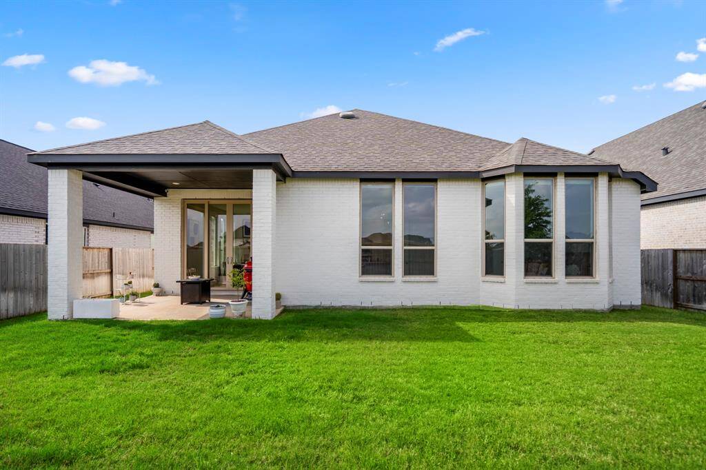 The back of the home includes plenty of windows, giving the perfect view of the private backyard and letting in plenty of natural light!
