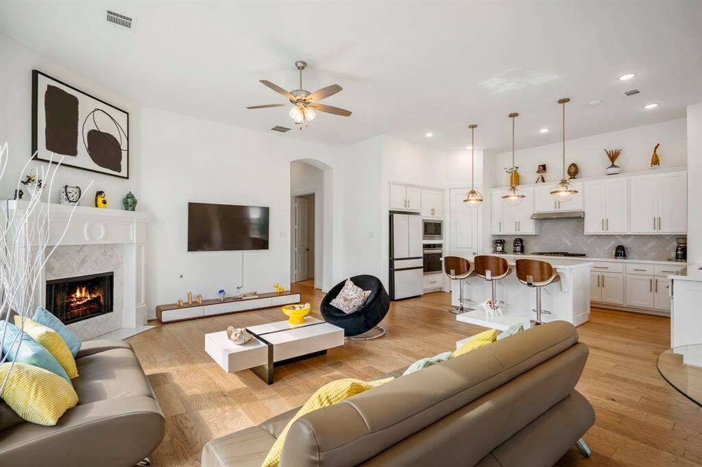 Another view shows just how open concept this kitchen and living room is. So much natural light and space! This light and bright spacious living room is the perfect layout for entertaining or just relaxing!
