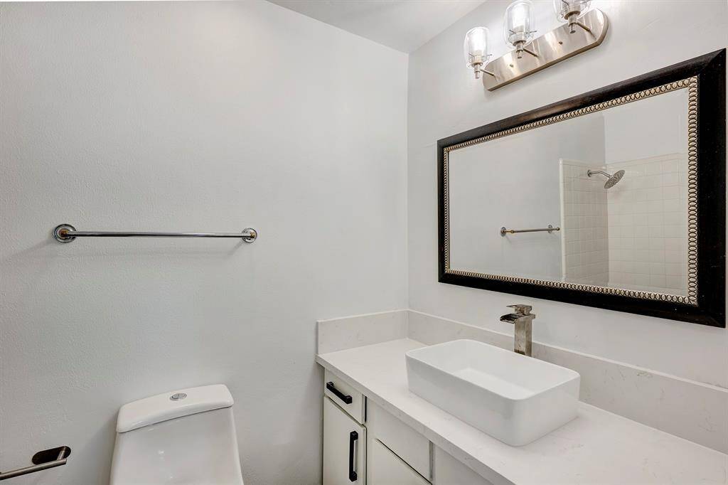 Secondary bathroom has tub shower.