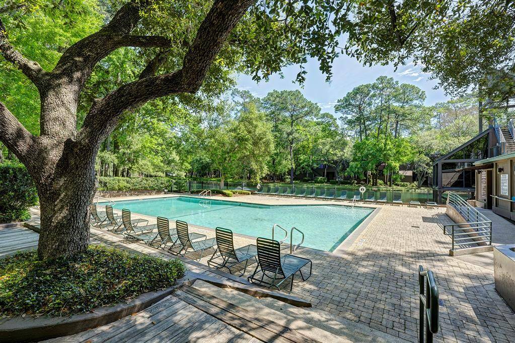 Beautiful mature trees around the pool and lake and throughout the community