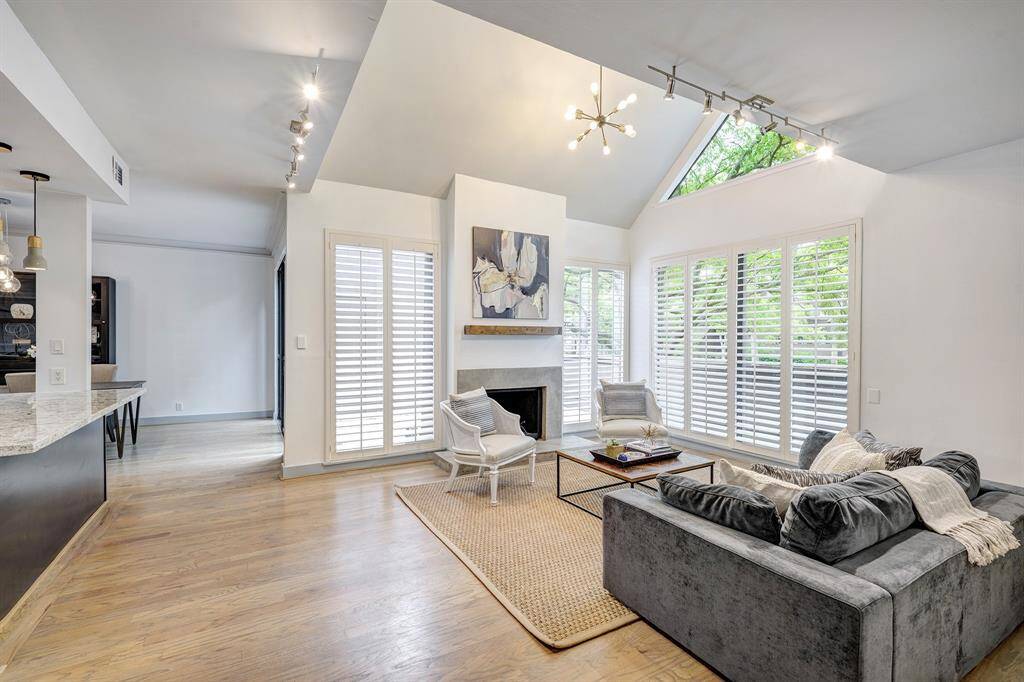 Lovely views of the patio and trees surround the fireplace.