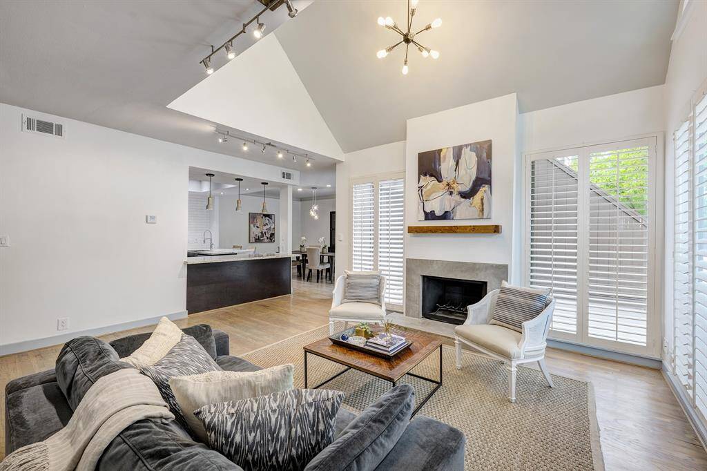 Living room is open to the kitchen and hardwood floors flow throughout the living and bedrooms.