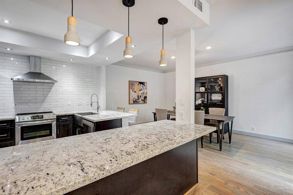Pendant lighting over the granite counter and additional seating room too!