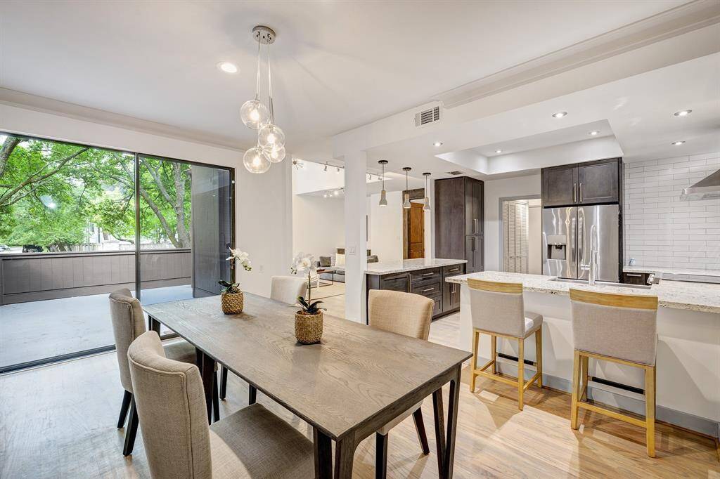 Dining room opens to the kitchen and living room and flows to the outdoor patio.  A lovely spot to dine and have treetop views.