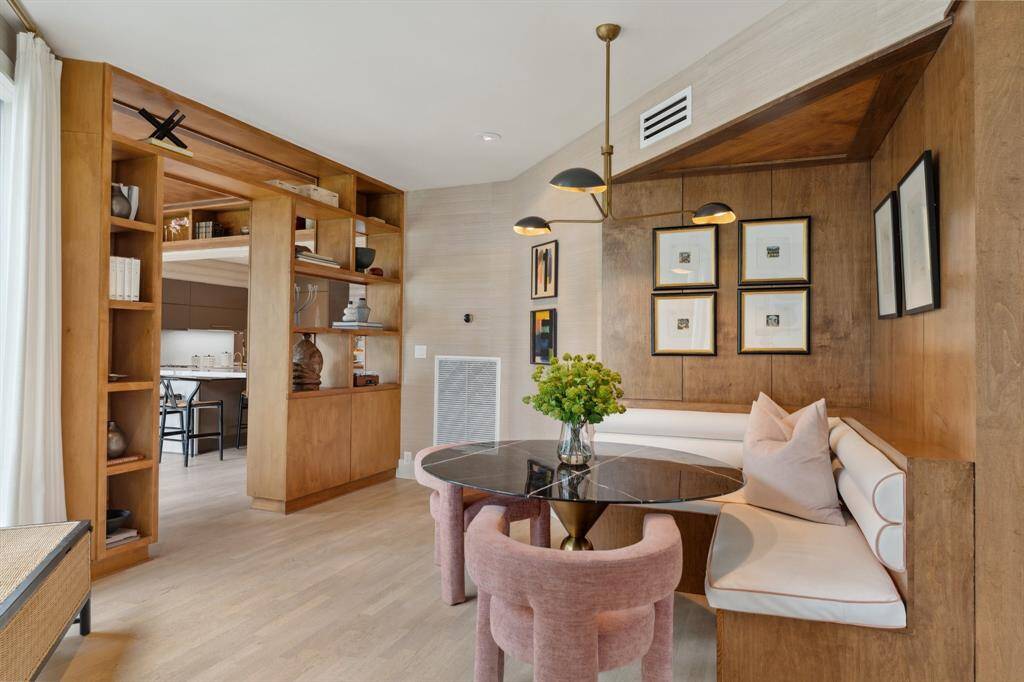 One more view of this cozy breakfast nook looking towards the gallery leading to the kitchen.