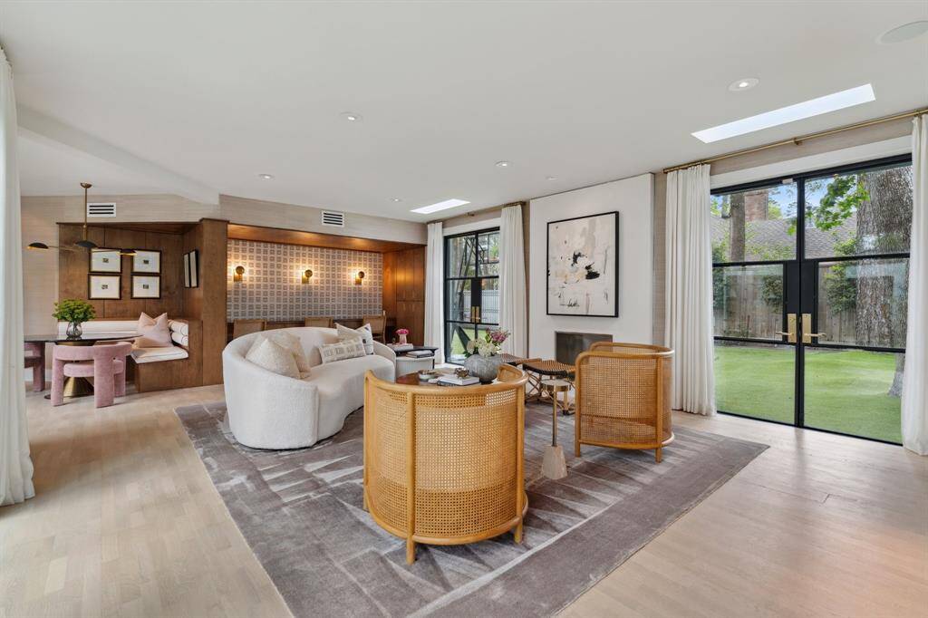 Another view of the family room showing the open floor plan with the breakfast nook and opening into a study space.