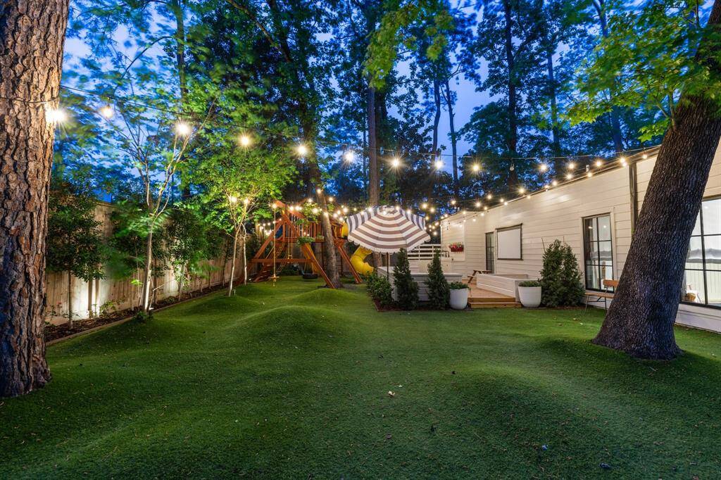 And a look at the large side yard at night.  Imagine movie nights under the stars!