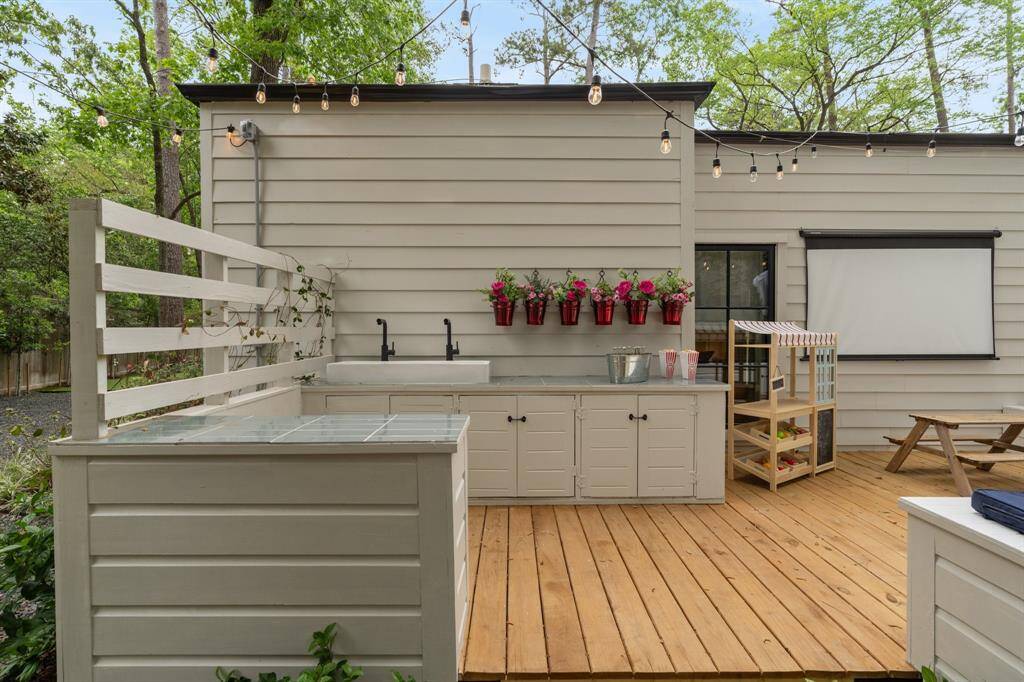 A dedicated gardening area includes a sink, two faucets and storage!