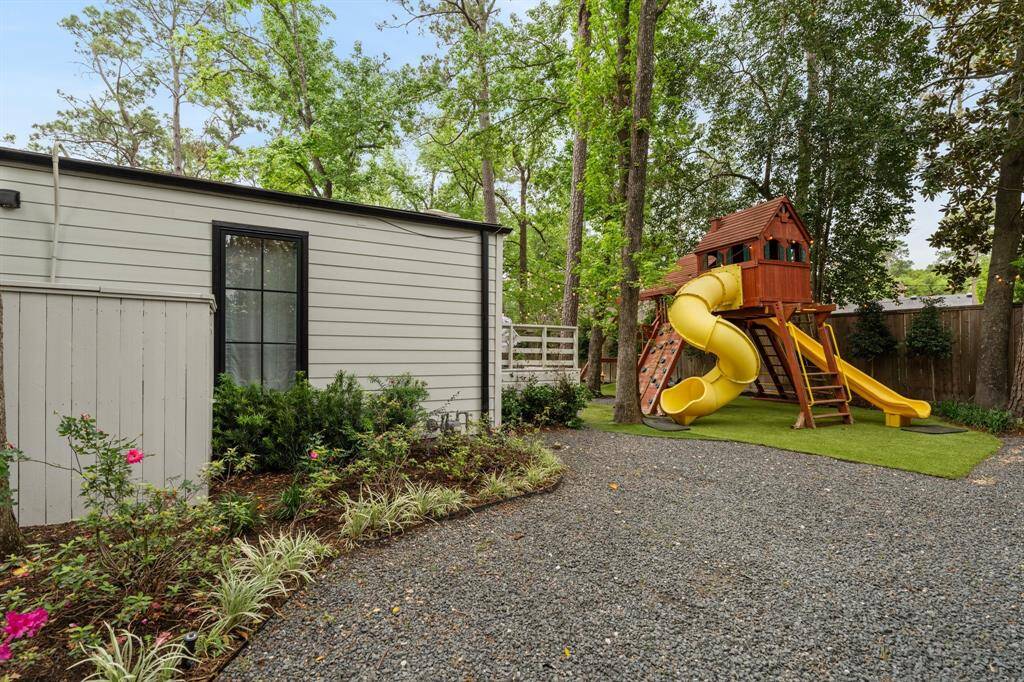 There is even space behind the playhouse for a trampoline!
