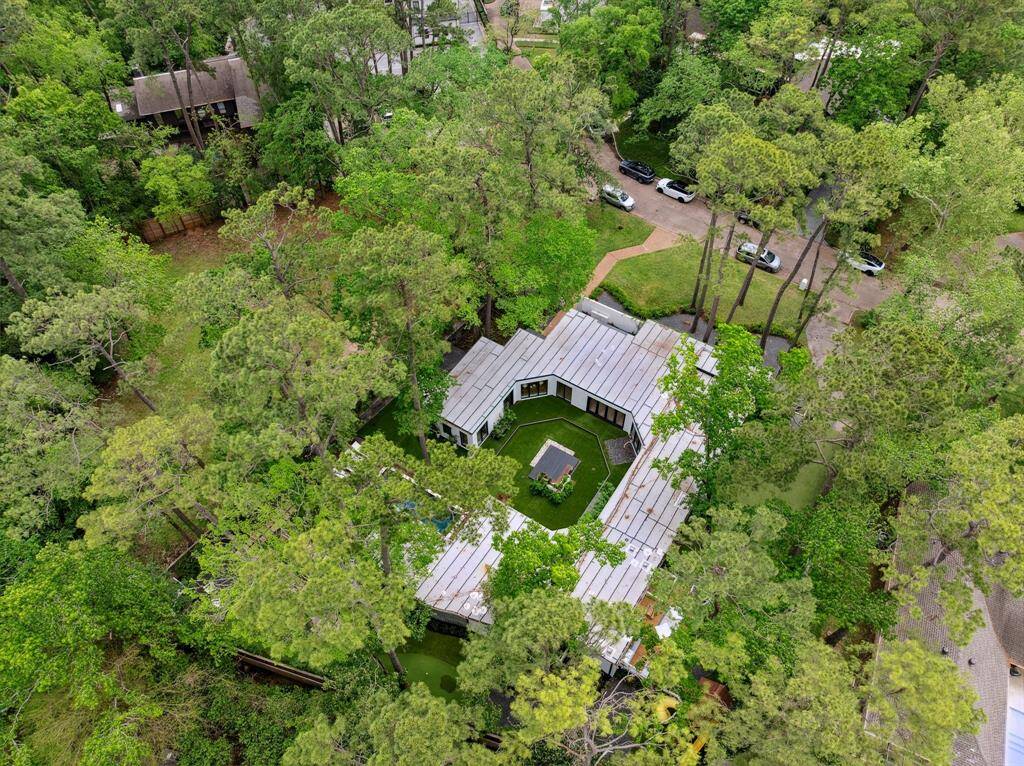 A look down to see how the house wraps itself around the main courtyard and nestles perfectly into the wooded backyard.