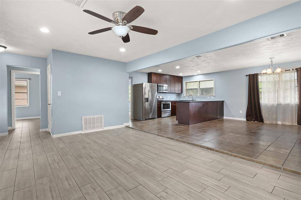 Open concept living room, kitchen, and dining room