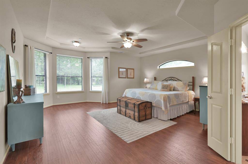 A Sitting Area provides a quiet spot to read a good book or just relax while looking out one of the bay windows to the back yard. You might see bunnies or a deer while you gaze.