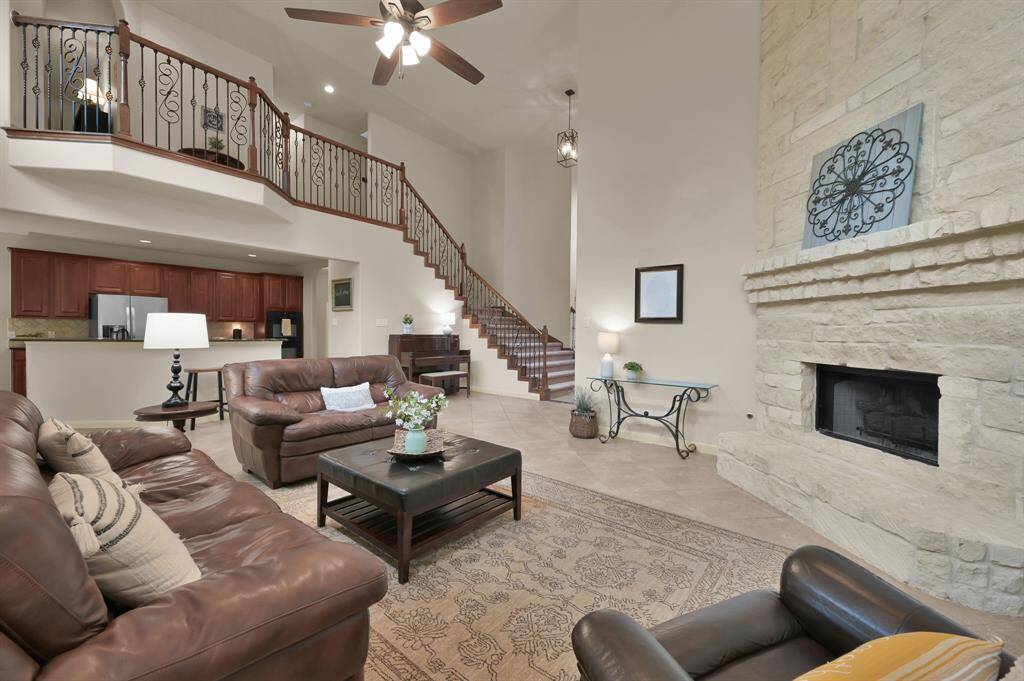 The iron and wood staircase leads you to the additional three bedrooms and two full baths.