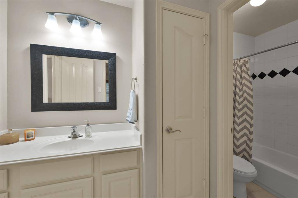 This Secondary Bath serves one upstairs bedroom as well as those enjoying the Game Room. It has a separate area for showering.