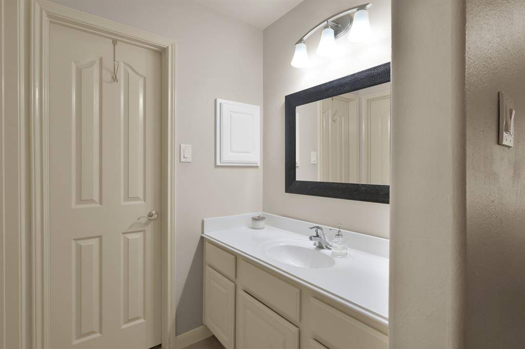 This is part of the upstairs  Hollywood Bath which connect two of the Secondary Rooms together. Each room has their own vanity and sink area.