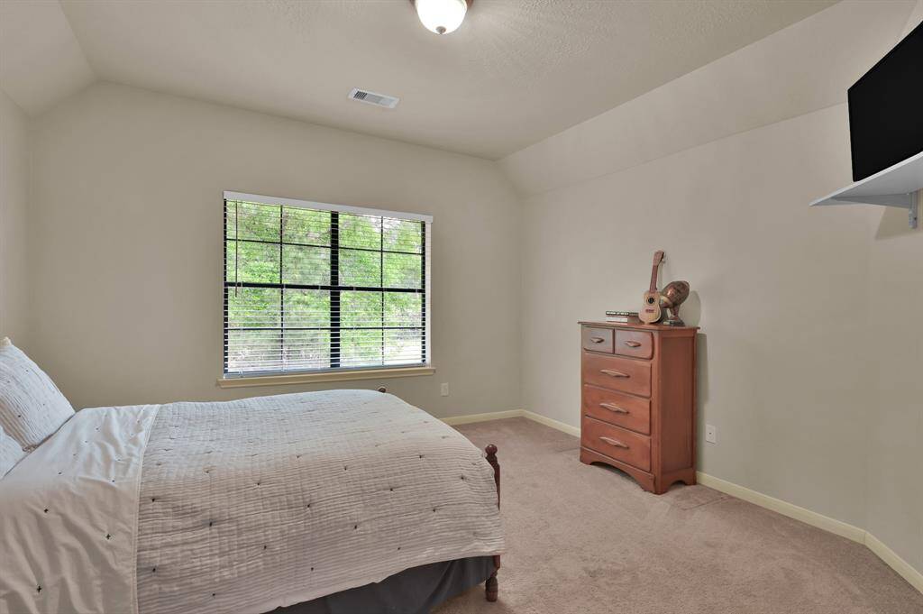 The third Secondary Bedroom located upstairs overlooking the front yard.