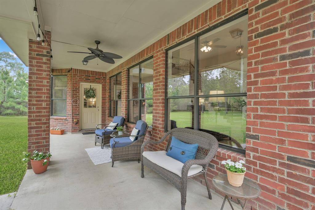 After a long day, enjoy resting on your covered back patio with a ceiling fan to keep cool while you watch for any wildlife passing through.