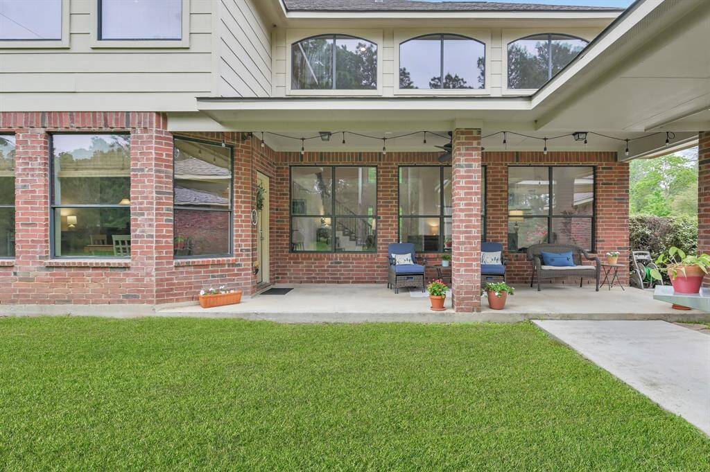 Enjoy watching sunsets from the back patio or from inside through the wall of windows on both floors of the home.