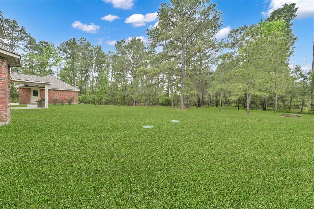 Another view of this generous lot with plenty of room for all kinds of outdoor activities. And when you are inside the home, rest easy that no unwanted critters will visit you or your attic since the seller had Critter Getter professionally install pest control home sealing in 2021. This cost over $3000.