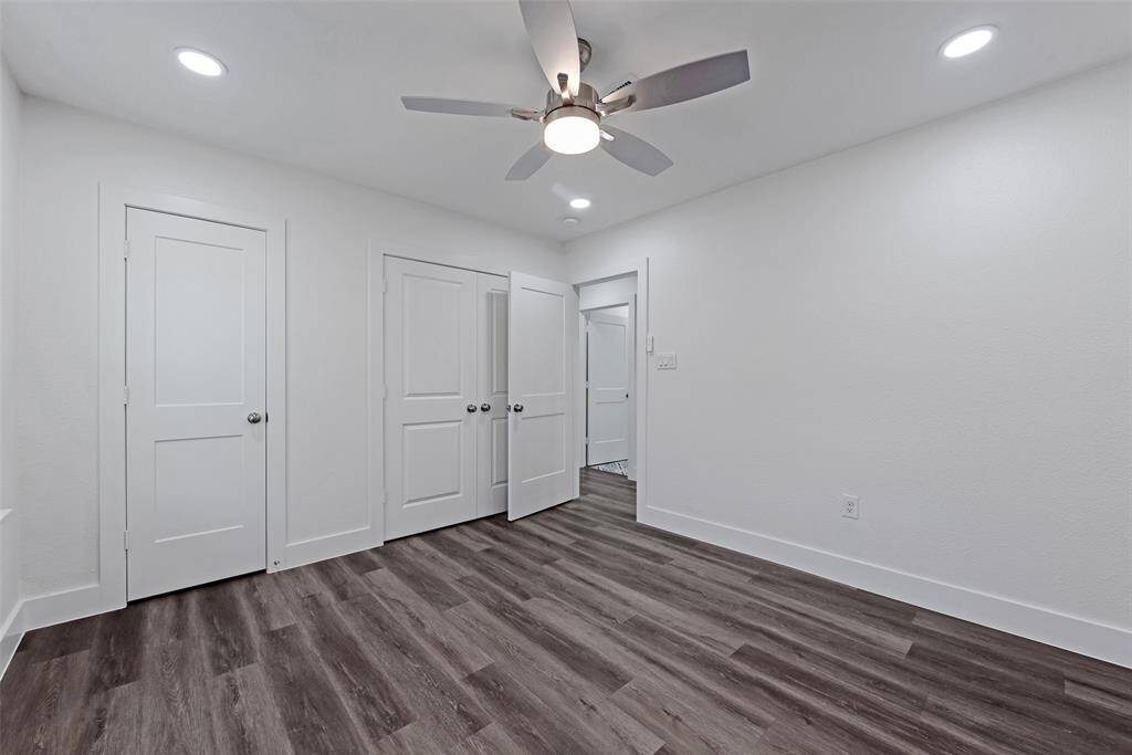 Spacious secondary bedroom with generous closet space.