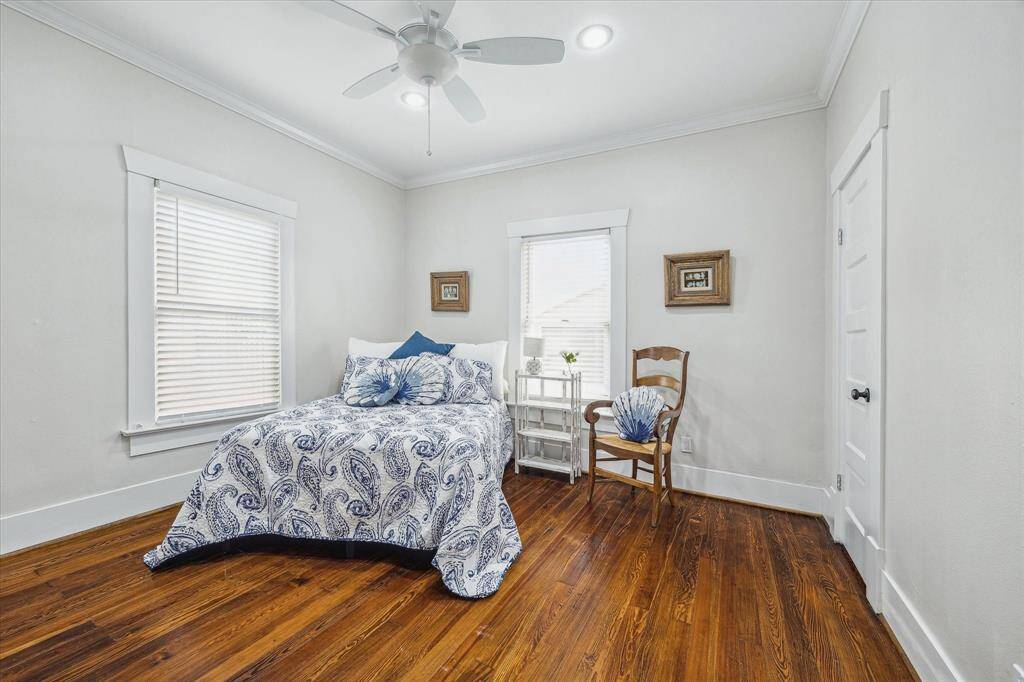 Primary bedroom with two closets, those gorgeous floors and high ceilings