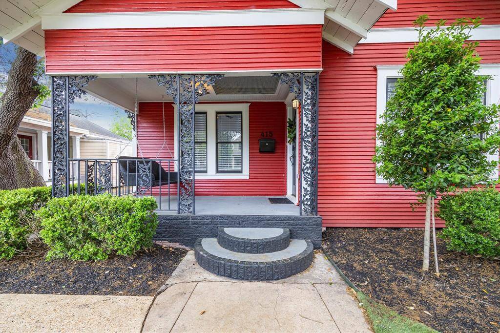 Beautiful iron works accent the front porch and a new mailbox also.