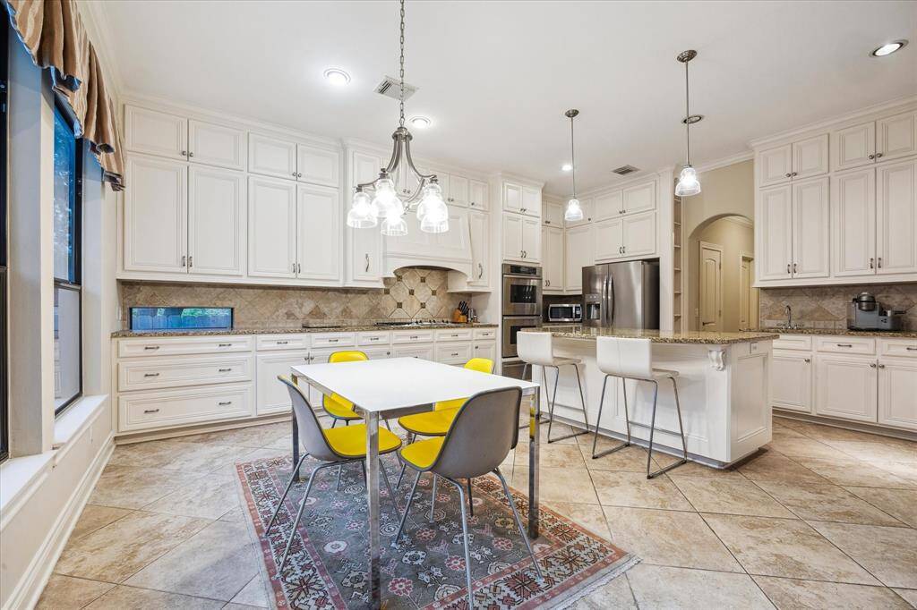 A shot of the Breakfast Room [18x 6] within the Kitchen that features space for a large table and overlooks the pool and backyard.
