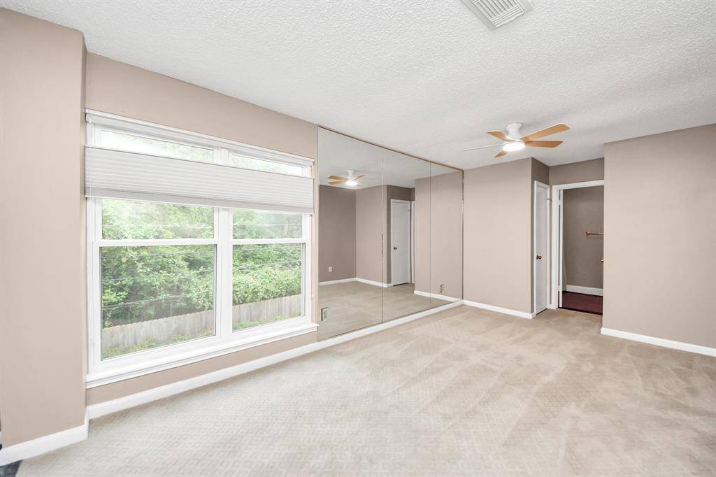 Another bedroom? No! It's the living room to the 1 bedroom apartment, complete with bathroom, kitchen and laundry room.