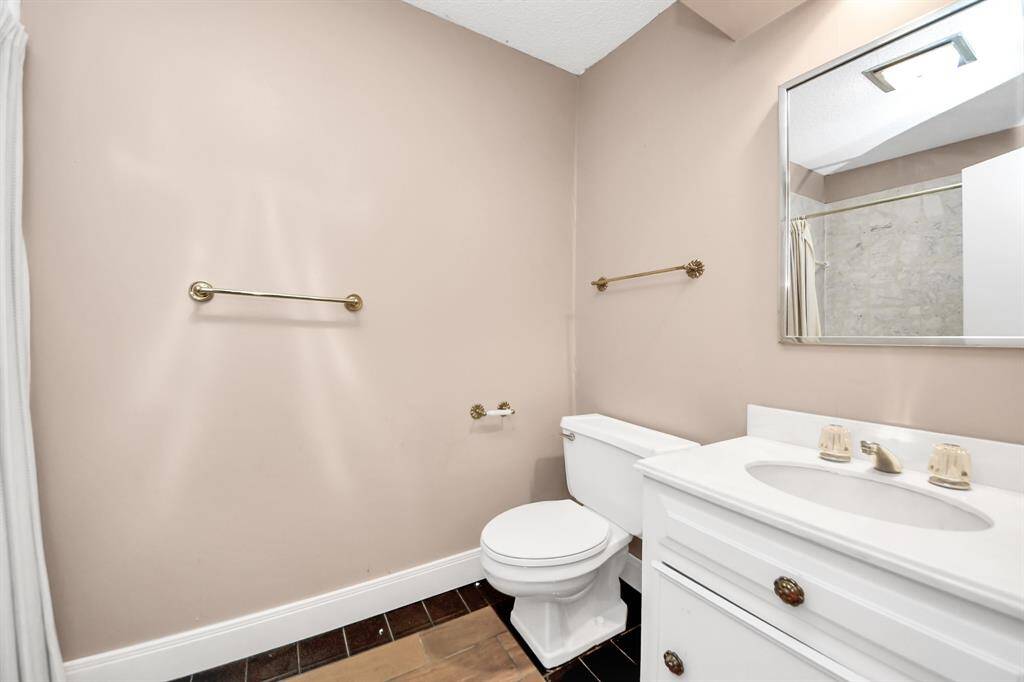 Apartment bathroom has full bath/shower and vanity