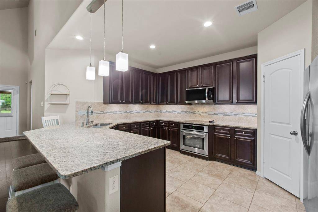 Kitchen with ample counter space and cabinets