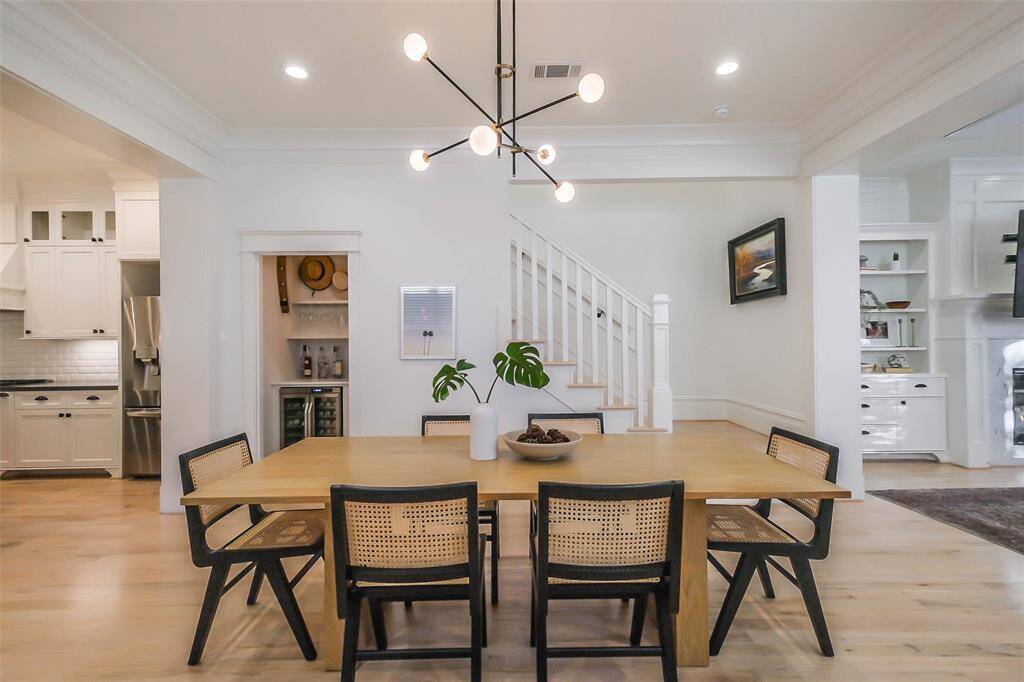 View of Formal Dining Room with wine room in the background.