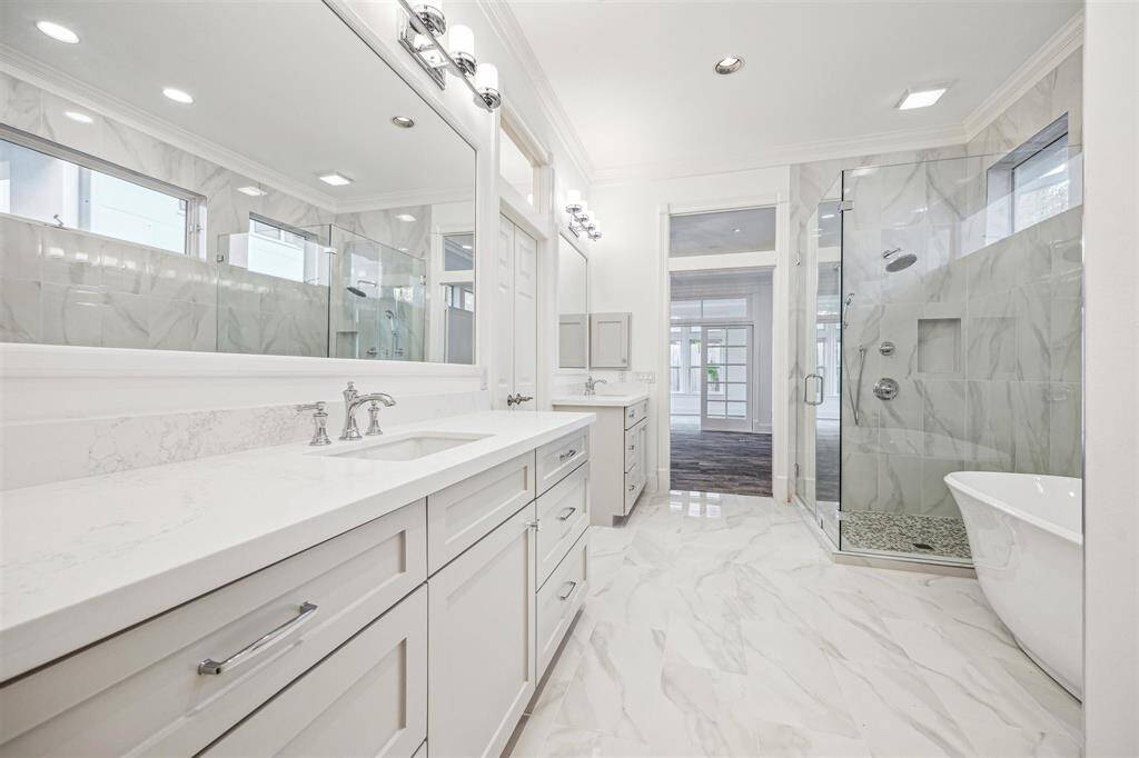 Incredible completely updated primary bathroom.  Please note the designer finishes throughout.