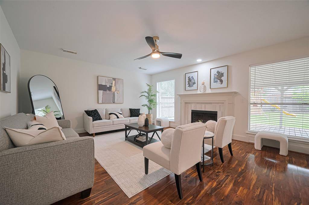 Bright, cozy living room with redesigned fire place ~ complete with an newly added electrical outlet above fireplace for convenient TV install!