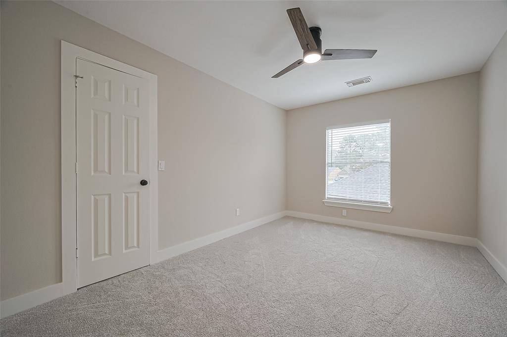 Bedroom 2 is a nice size & has a custom built walk-in closet with extra storage and a window!