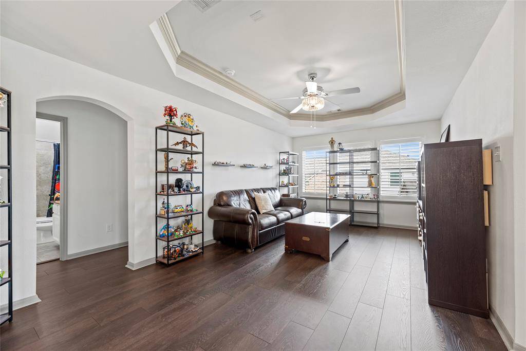 Game room with vinyl flooring and great natural lighting.